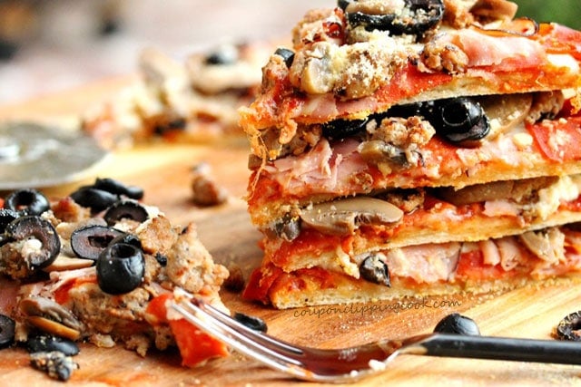 Boboli Bread Pizza with Sausage, Ham, Mushrooms and Pepperoni on board