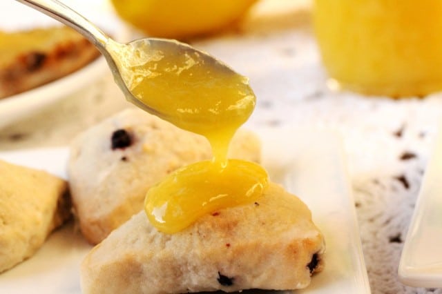 Spoon Lemon Curd on Biscuit on plate