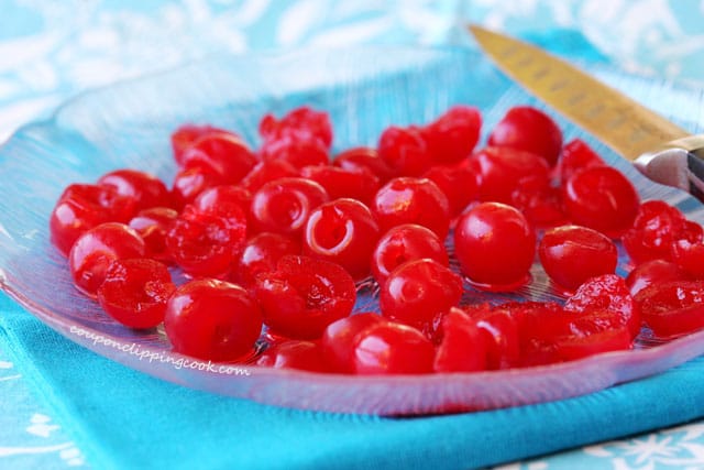 Cut maraschino cherries on plate
