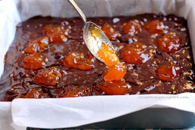 Add apricot preserves on brownie batter