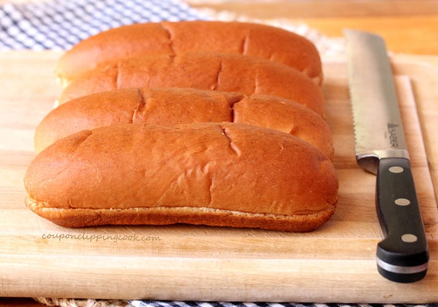 Hot dog buns on cutting board