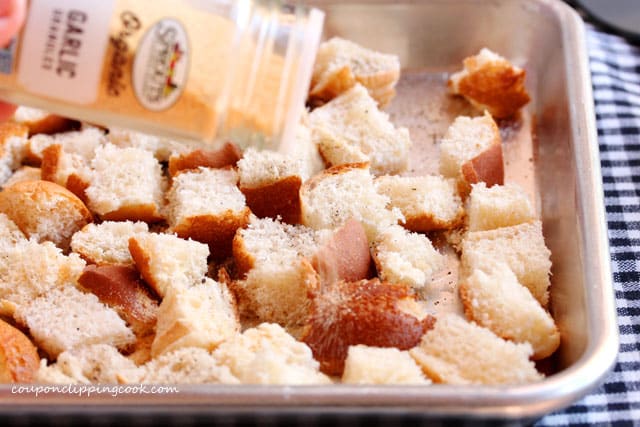 Add garlic powder on bread pieces
