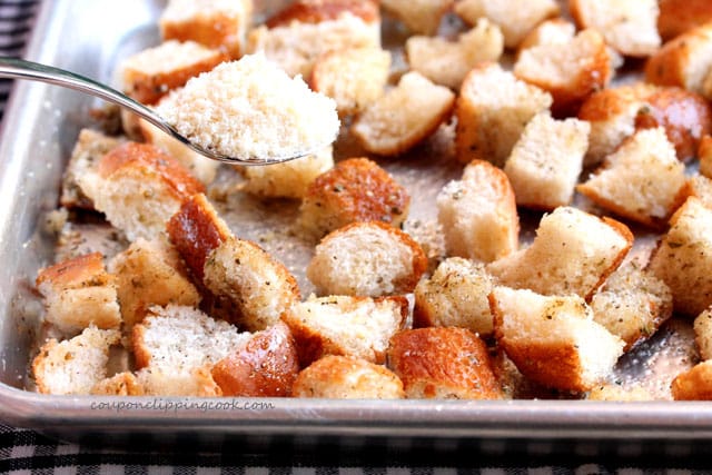 Add Parmesan cheese on cut pieces of bread