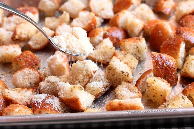 Sprinkle Parmesan cheese on croutons