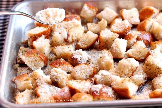 Add Parmesan cheese on cut pieces of bread