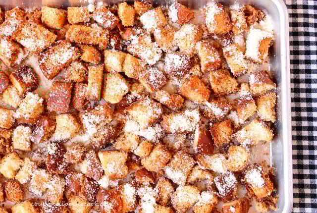 Baked seasoned croutons on pan