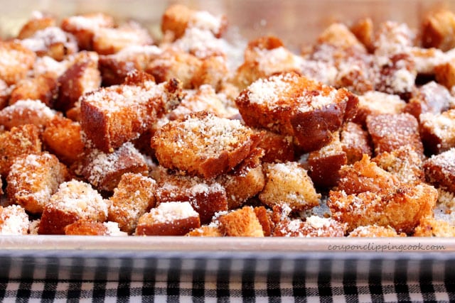Parmesan seasoned croutons on pan