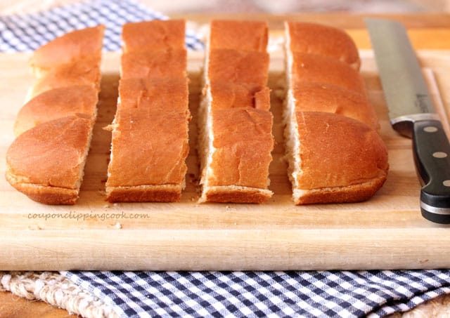 Cut hot dog buns on cutting board