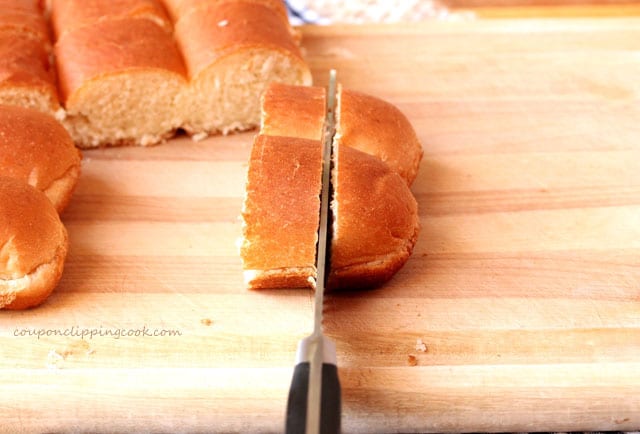 Cutting hot dog buns on board