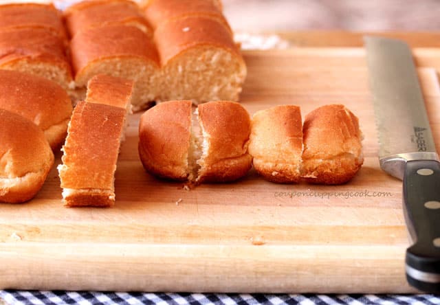 Cut hot dog buns on board