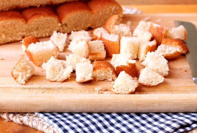 Cut hot dog buns on cutting board