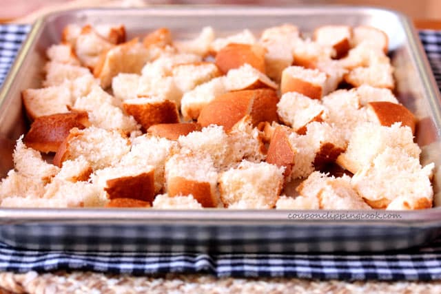 Cut hot dog buns on pan