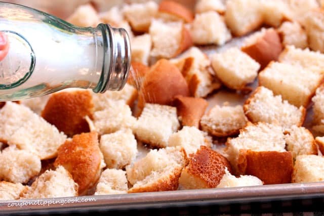 Add salt on cut bread for croutons